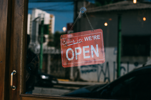 an open sign in a shop window